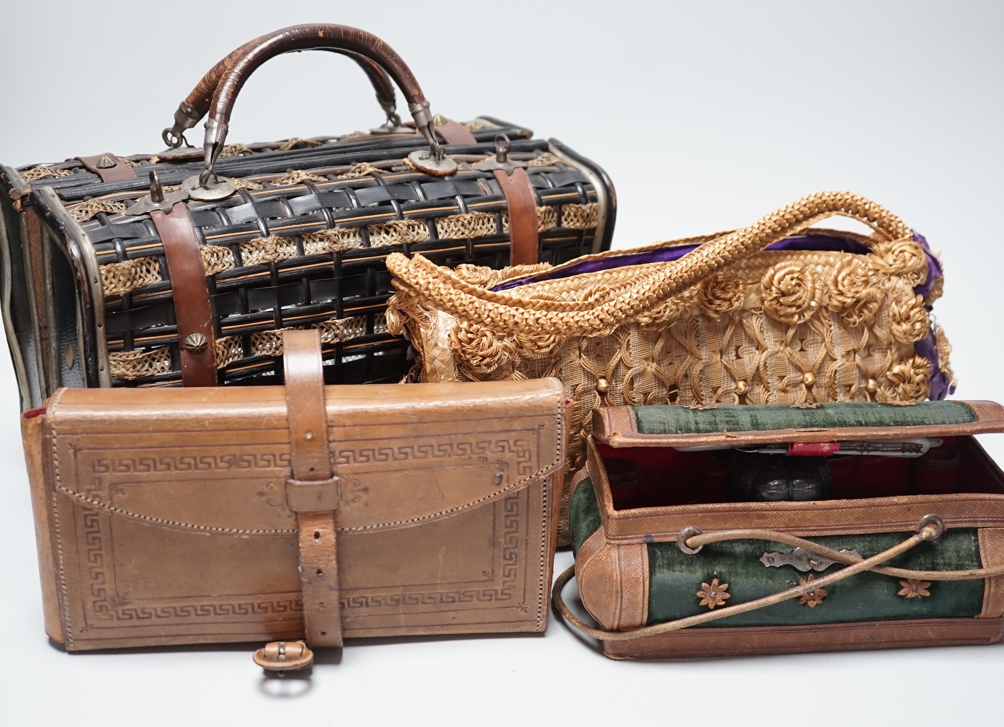 An unusual Edwardian straw and braided basket/bag, a French late 19th century basket with makers mark on metal mounts Berthelon, Macon, a small leather and velvet vanity case and contents and leather stationary case